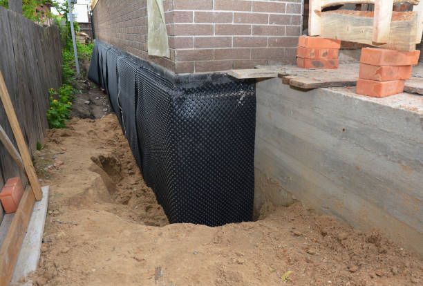 SJ Waterproofing Pros technician performing targeted Interior Drainage System assessment in Geneseo, NY